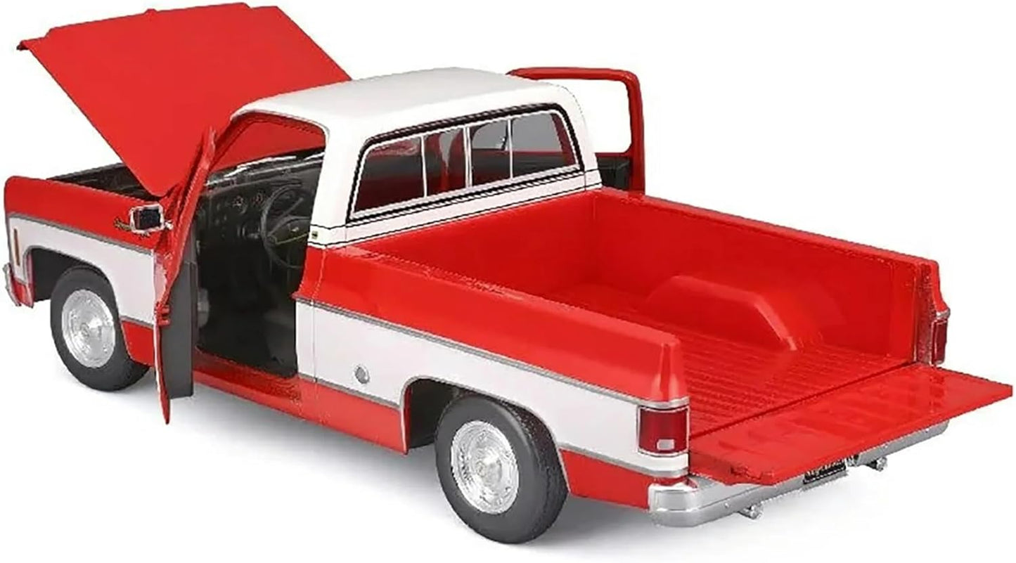 Model of a red and white pickup truck with open doors and bed on a white background