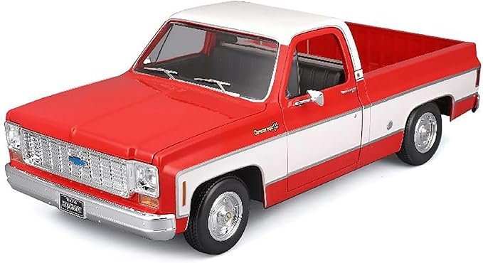 Model of a red and white pickup truck on a white background
